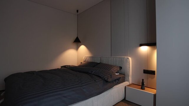 Modern bedroom interior with warm bedside lighting