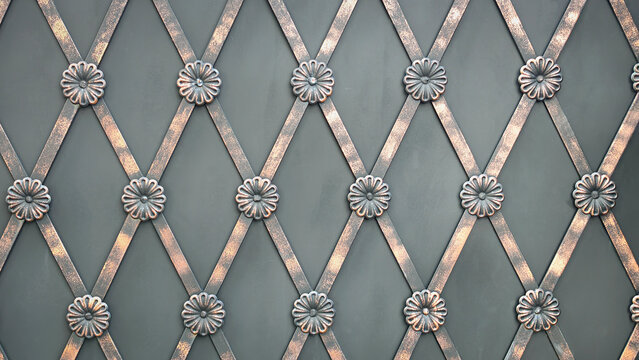 Wrought iron fence ornament texture background. Ornate forged metal lattice pattern with bronze patina rosettes.