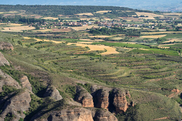 Fototapeta premium Vineyards and Eroded Rock Formations Near Islallana