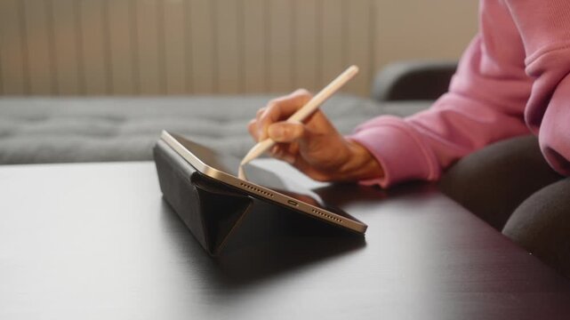 Hand Writing on Digital Tablet With Stylus Close-Up