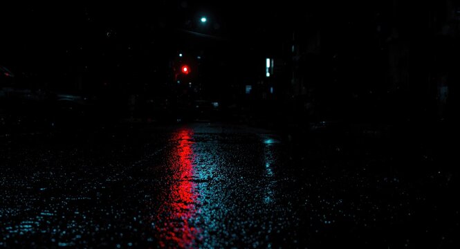 Neon lights reflecting on wet pavement in a nighttime urban scene with abstract black backdrop