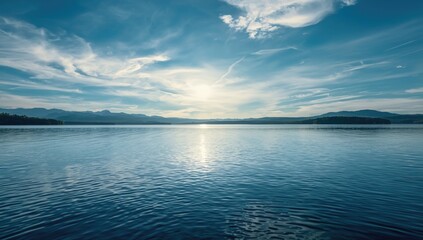 Obraz premium Relaxing lakescape portraying a calm water body with a brilliant sky backdrop