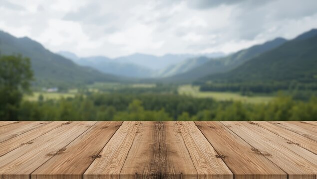 Wooden table with blurred mountain landscape in background