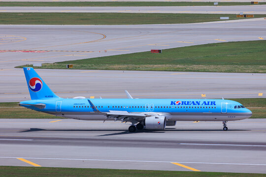 Incheon South Korea - 2025 07 05: A Korean Air Airbus A321neo taxis at Incheon International Airport near Seoul, side profile.