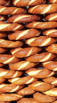 Fresh simit display in Istanbul market during daytime
