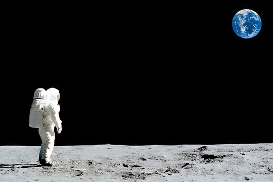 Astronaut standing on the moon surface looking at planet Earth from deep space, Rear view of cosmonaut in spacesuit on lunar surface watching blue Earth, space exploration concept.