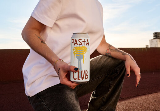 Mockup of a Tall Boy Can Held on a Rooftop