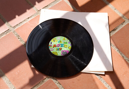 Mockup of Vinyl record on tiles