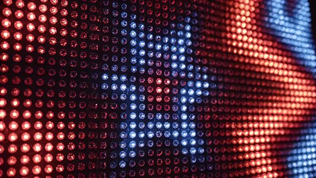 Close-up view of a grid of red and blue lights, creating an abstract pattern
