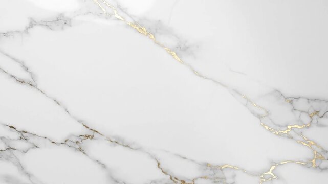 A smooth white marble surface with elegant golden vein patterns