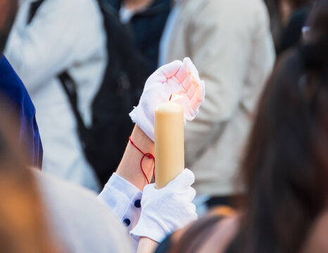Lone candle guiding devotion through Granada&rsquo;s solemn holy week procession