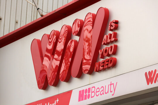 DANANG, VIETNAM - JANUARY 22, 2026: The corporate 3D logo sign of WinMart supermarket with its promotional slogan is All you need displayed on a wall.
