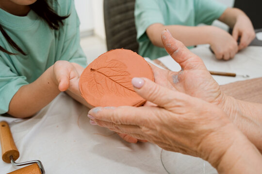 Clay Activity With Grandmother and Child at Home During Creative Time