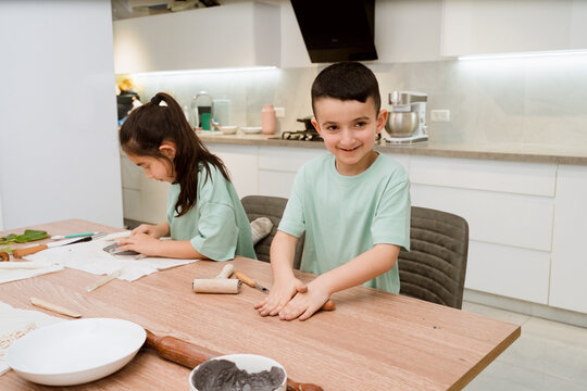 Kids Working With Clay at Home During a Crafting Session