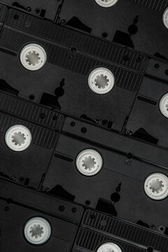 Vintage black videotapes arranged in rows