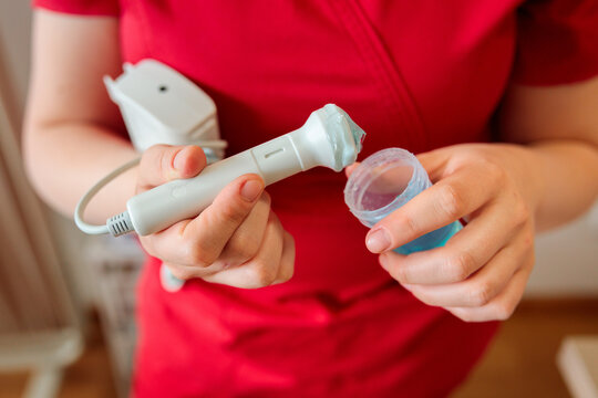 Midwife preparing Doppler fetal monitor