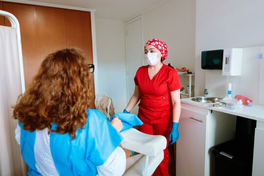 Midwife and patient after clinical examination