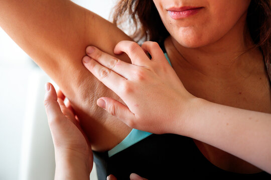 Close-up of professional axillary palpation