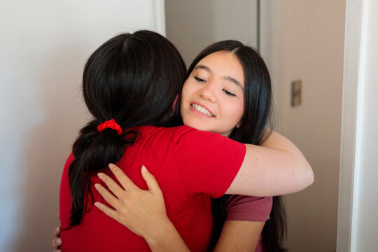 Young patient hugging midwife after consultation