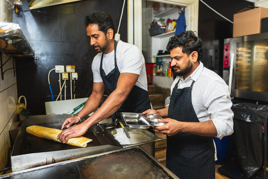 Restaurant team working together in the kitchen
