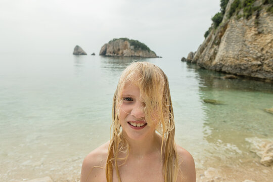 Funny teenage girl after swimming in the sea