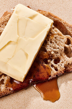 Slice of bread with butter and honey