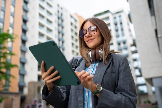 Woman using tablet in urban area