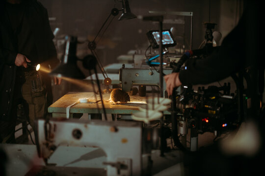 Professional cinema and video camera on the set. Shooting shift, lighting fixtures, shooting equipment and the team. Technique of modern filming and advertising.