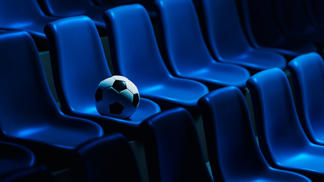 Soccer ball rests on blue stadium seats in an empty arena