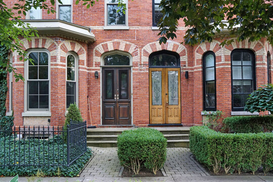 Victorian townhouses with polychromatic brick design, common in downtown Toronto