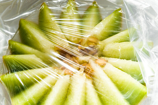 Fresh Fruit Preparation in a Kitchen With Wrapped Slices