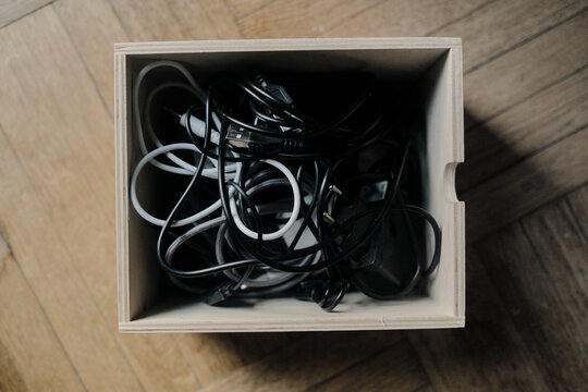 Organizing a drawer with tangled cords and cables