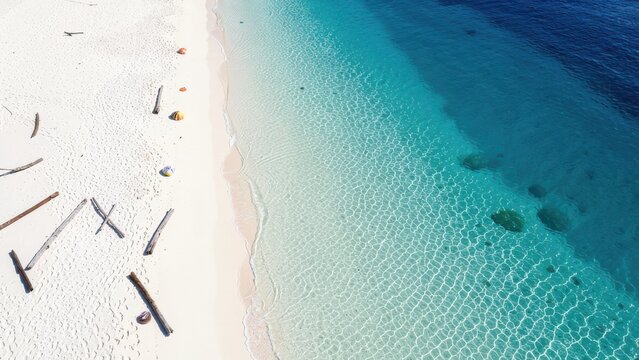 pristine tropical beach aerial view with white sand and turquoise water ideal for luxury travel advertisement background