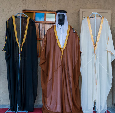 Arabian Man Wearing Traditional Bisht Cloak and Thobe Attire