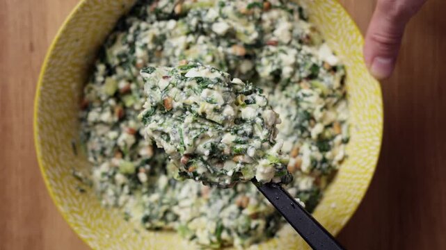 Greek Spinach Feta Pie Filling On Spoon Close Up Top View