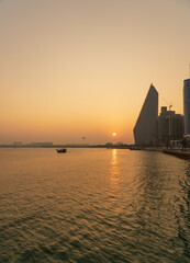 Fototapeta premium Vibrant Doha Corniche Waterfront with Tourists Enjoying Sea Views