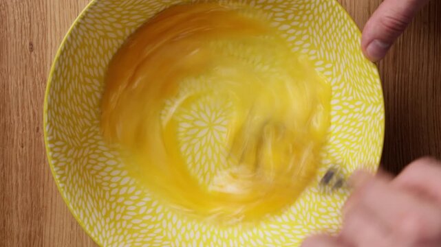 Whisking Eggs In Bowl Top View
