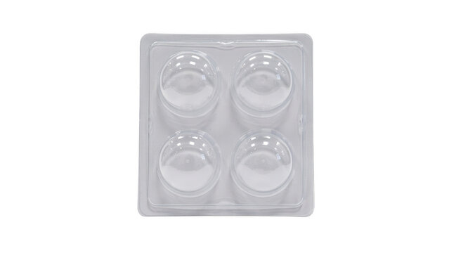 Empty clear plastic blister pack with four round compartments isolated on transparent background