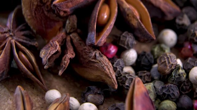 Star Anise (Illicium verum) and Mixed Peppercorns. Selective perfume ingredients. Traditional oriental spice pharmacology. Organic wellness treatment raw material.