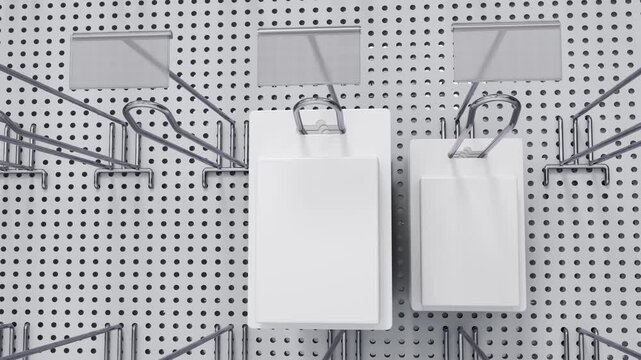 Close-up of a realistic retail display with pegboard double hooks, price tag holders, and blister-packed products gradually appearing on the display. 3d animation