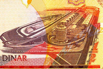 Naklejka premium Bahraini half dinar banknote featuring the Bahrain International Formula One racetrack. Bahraini money.