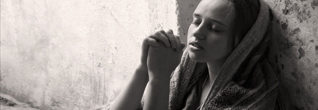 Poor young girl prayint to God