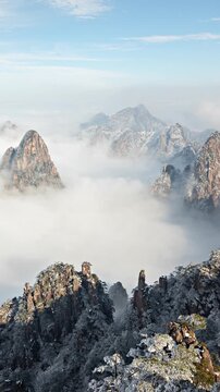 Time lapse looking out over a sea of fog at the Yellow Mountains (Huangshan) in China. Vertical video.