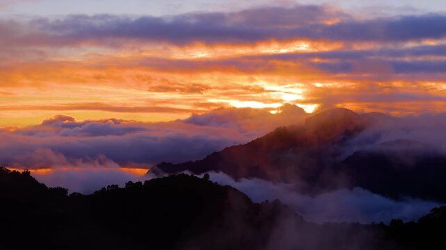 Morning fog covers the terraced rice paddies in the mountains near the town of Banaue Philippines.