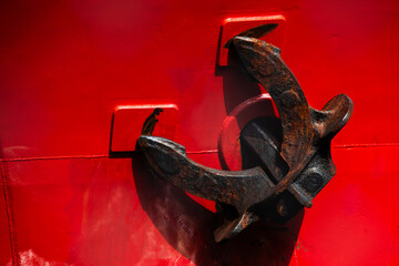 Ship Anchor on Red Hull of Commercial Vessel Close Up © Jane Allan