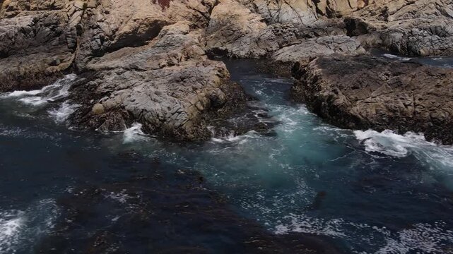 Aerial shot of the rugged coastline along the Pacific Coast Highway in Central California