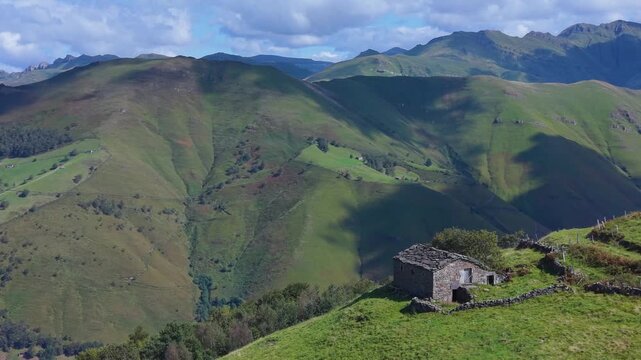 Aerial drone view of the landscape around San Pedro del Romeral. Pas-Miera region. Pasiegos Valleys. Cantabria. Spain. Europe