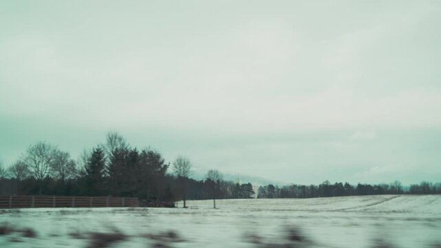 View through windshield while driving from Liberec toward Macha Lake. Road trip in Czech countryside during winter.