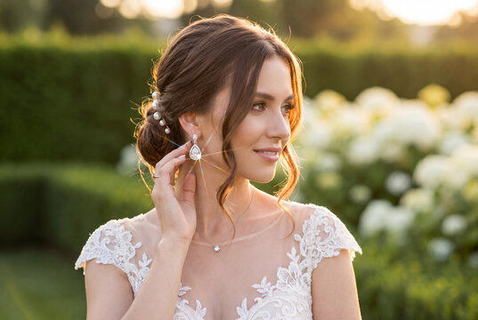 The bride wearing diamond earrings.