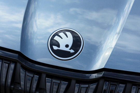 Koprivnice, Czech Republic, Czechia - 31 May, 2026: Skoda auto - logo and brand of car manufacturer. Detail of gray vehicle with metallic paint. Shallow focus.	